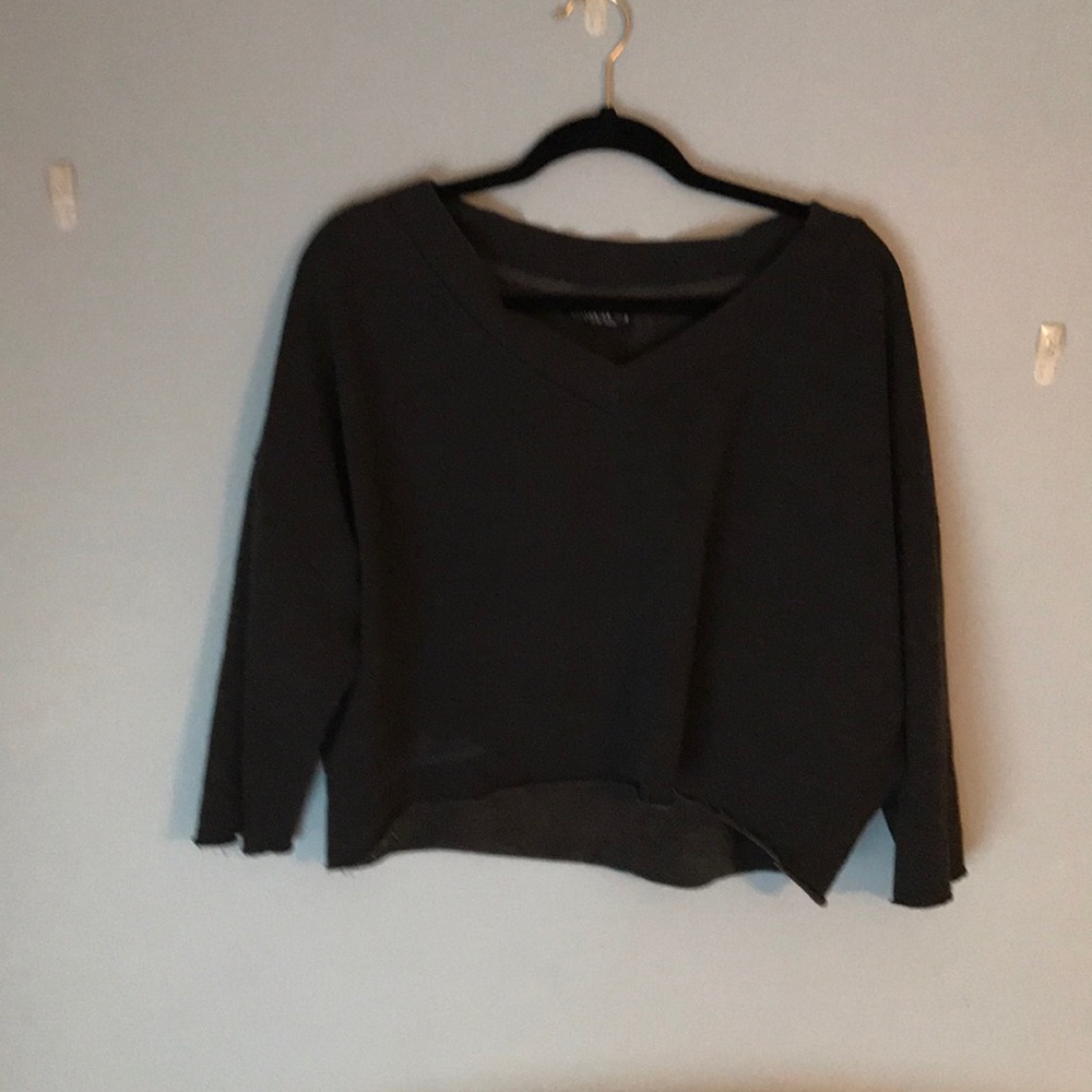 A gray cropped hoodie.